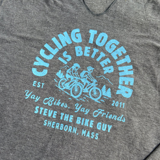 Blue imprint with two riders which says "Cycling Together is Better." Yay Bikes. yay Friends. Steve the BIke Guy